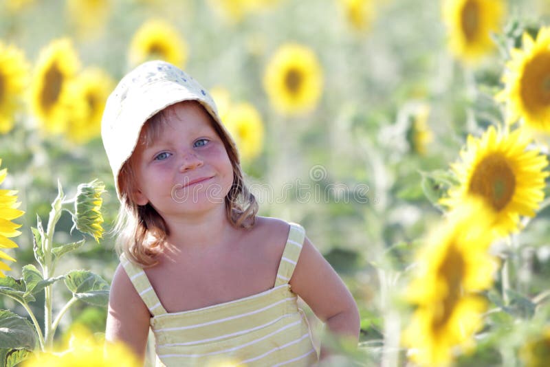 Happy child in sunflower field