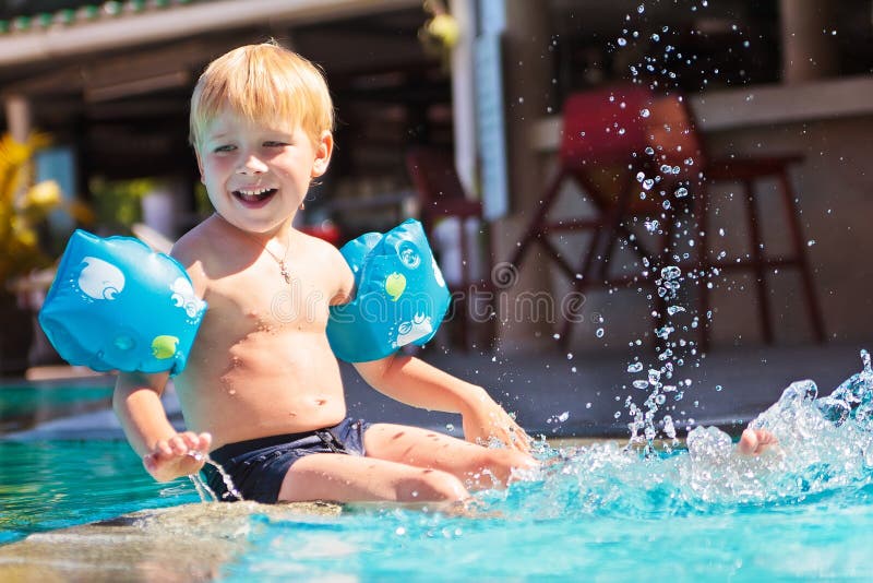 Happy child in the swimming-pool