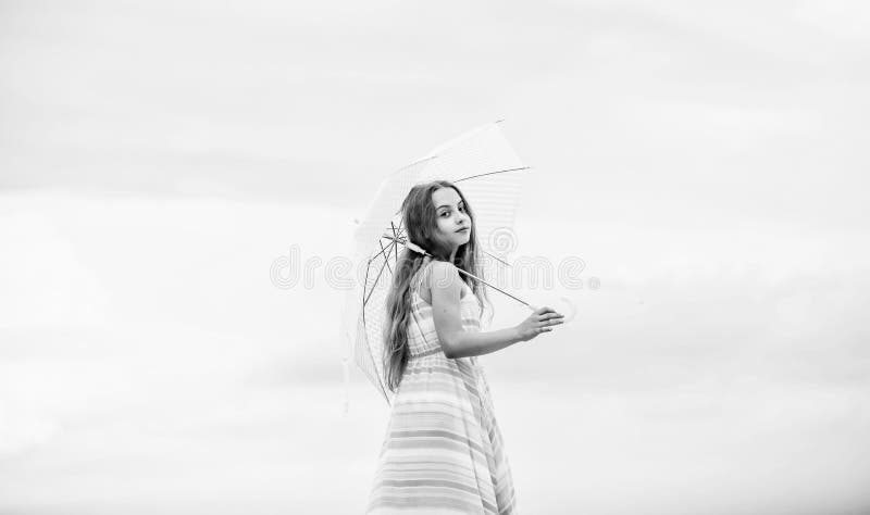 Happy childhood. I believe i can fly. Touch sky. Fairy tale character. Feeling light. Girl with light umbrella. Anti. Gravitation. Fly drop parachute. Dreaming stock photography Happy childhood. I believe i can fly. Touch sky. Fairy tale character. Feeling light. Girl with light umbrella. Anti. Gravitation. Fly drop parachute. Dreaming stock photography
