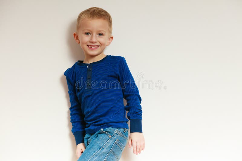 Happy childhood. Portrait of smiling blond boy child kid indoor stock images Happy childhood. Portrait of smiling blond boy child kid indoor stock images