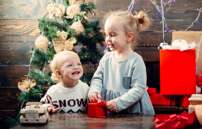 Happy children. Babies. Children gift. Christmas story concept. New year kids. Christmas kids. Happy small kids in santa stock image Happy children. Babies. Children gift. Christmas story concept. New year kids. Christmas kids. Happy small kids in santa stock image