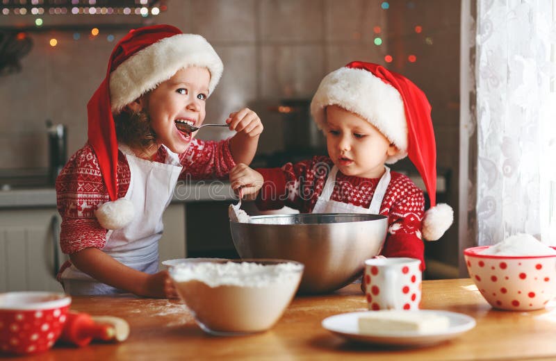 Happy children bake christmas cookies