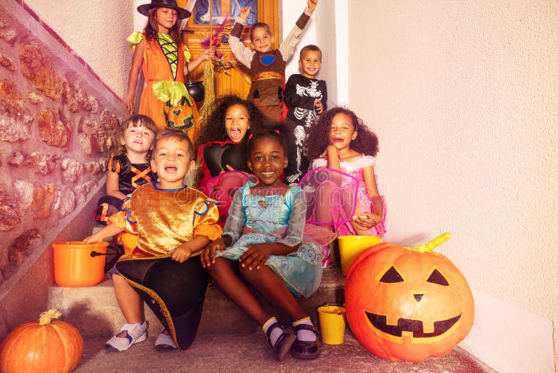 Halloween Kids in Playhouse Window with Buckets Stock Photo - Image of ...