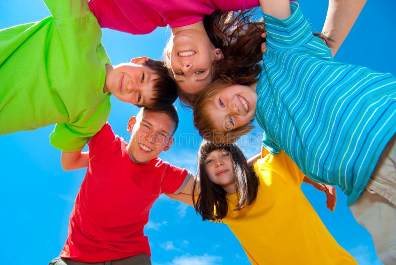 Happy children in huddle stock photo