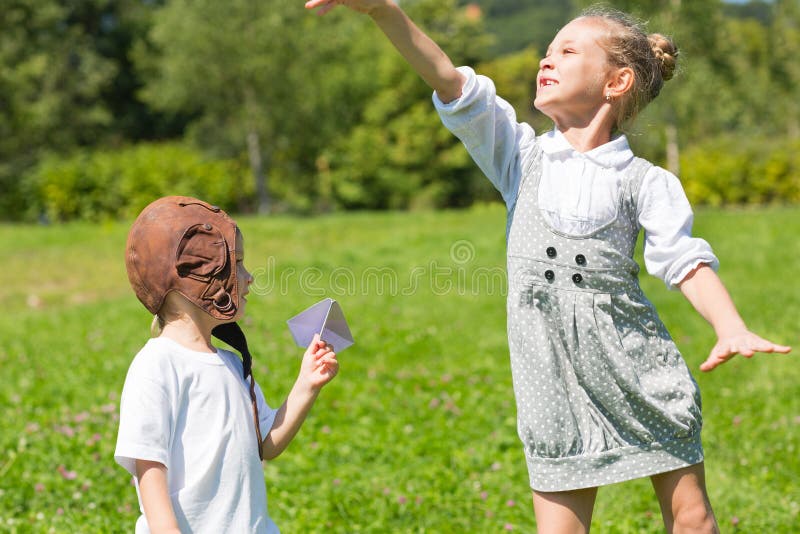 Happy children playing in the paper plane royalty free stock photography Happy children playing in the paper plane royalty free stock photography