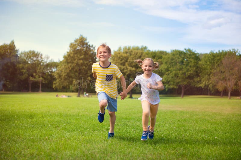 Happy children running in park stock photography Happy children running in park stock photography