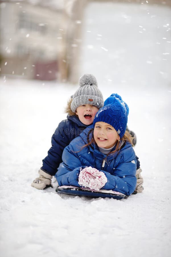Happy children on the snow stock photos