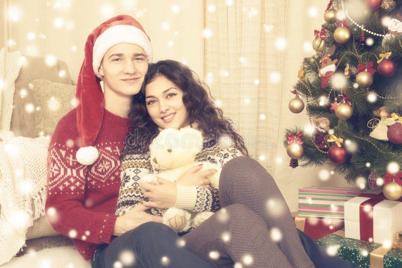 Happy Couple Celebrate Christmas At Home. Winter Holiday And Love Concept. Xmas Tree And Gifts ...