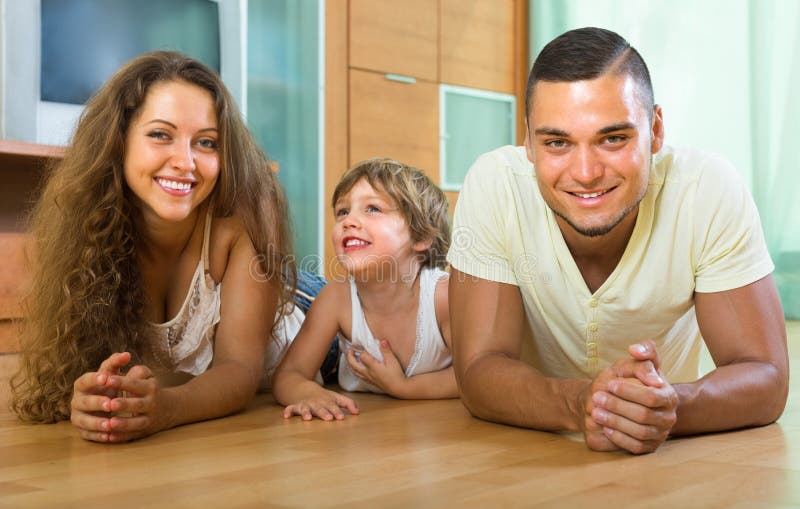 Happy couple with child at home royalty free stock photography Happy couple with child at home royalty free stock photography