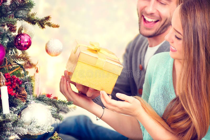 Happy Couple with Christmas Gift stock photography