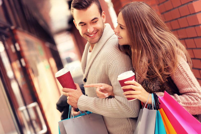 Happy couple with coffee shopping in the mall stock images Happy couple with coffee shopping in the mall stock images