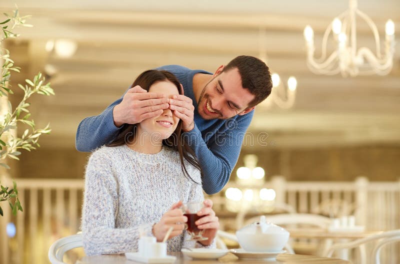 Happy couple drinking tea at cafe royalty free stock photography Happy couple drinking tea at cafe royalty free stock photography