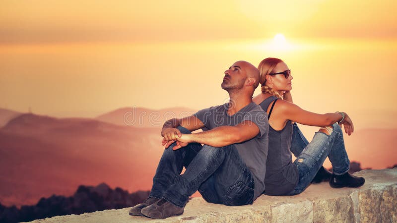 Happy couple enjoying sunset view royalty free stock photography Happy couple enjoying sunset view royalty free stock photography