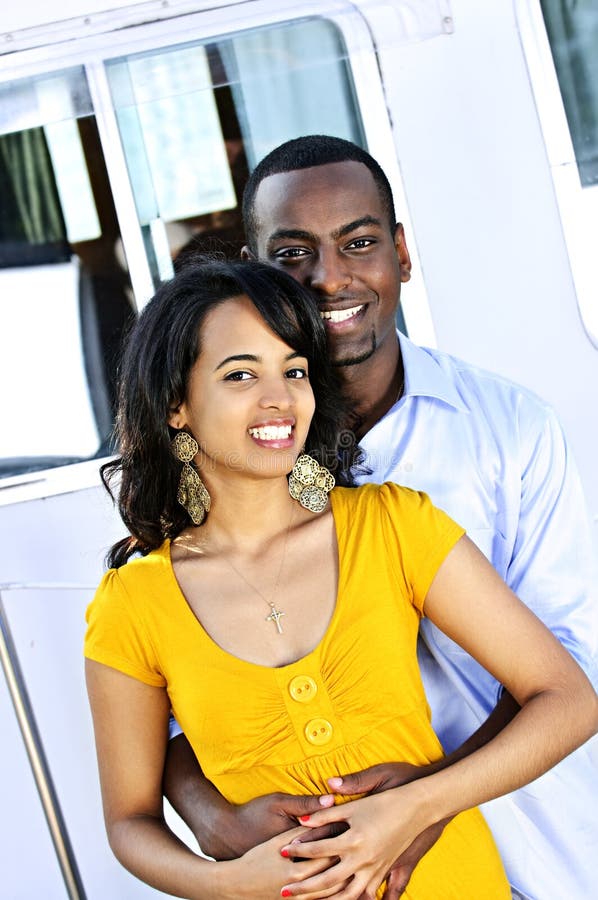 Happy couple in front of yacht stock images Happy couple in front of yacht stock images
