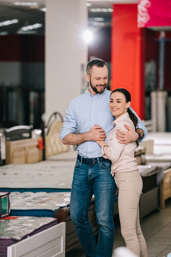happy couple in furniture store stock photo happy couple in furniture store stock photo