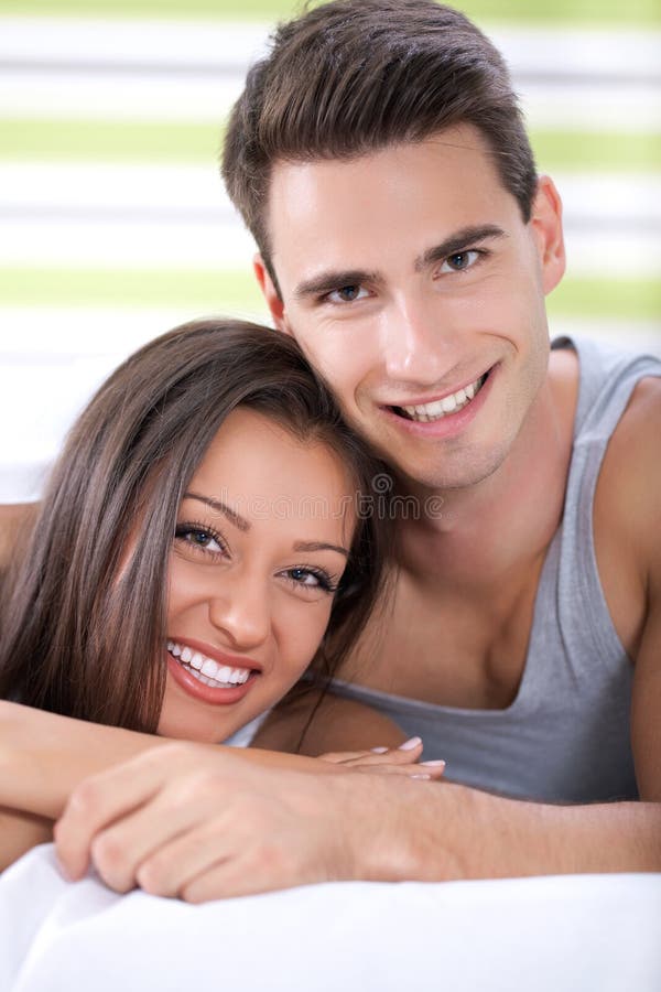 Couple hugging in bed stock image. Image of natural, home 26796169