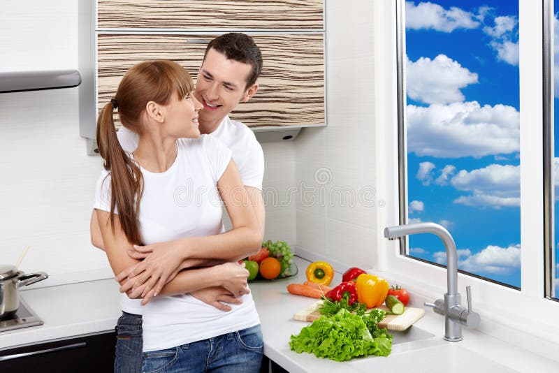 Happy couple at kitchen