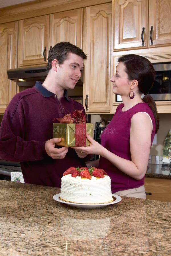 Happy Couple in the Kitchen - Vertical