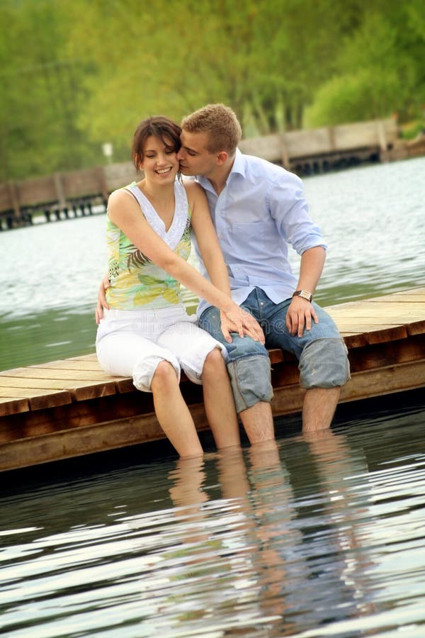 Happy couple on a lake