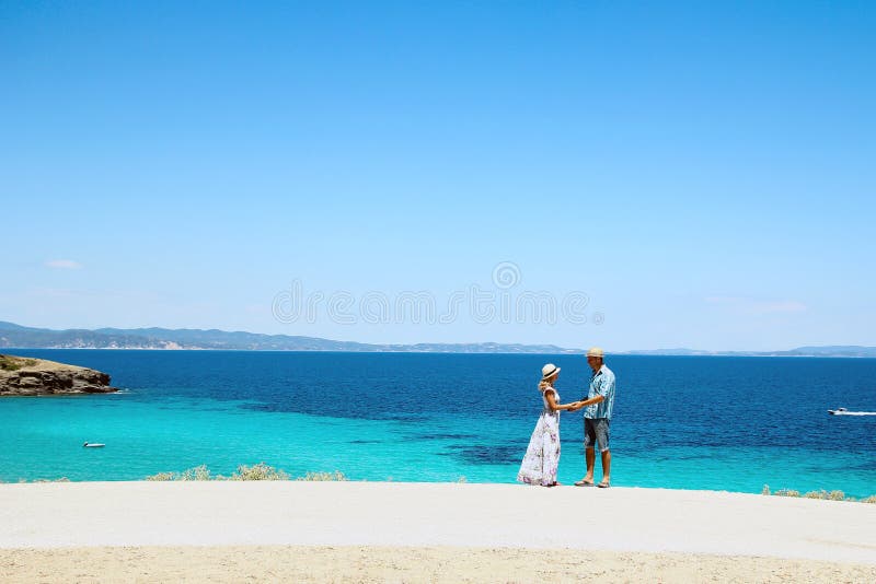 Happy couple in love on the beach