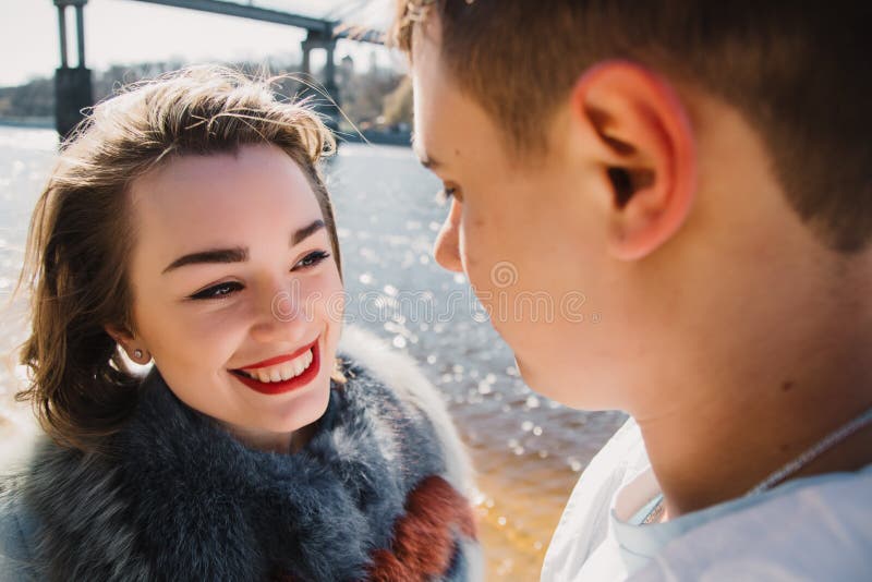 Happy Couple In Love Hugging And Sharing Emotions Holding Hands On