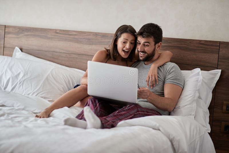 Bed Room Sex - Happy Couple Lying on a Bed with Computer - Beautiful Married Couple  Watching Sex Video on Laptop Laughing Together - People, Stock Photo -  Image of online, hotel: 139540032