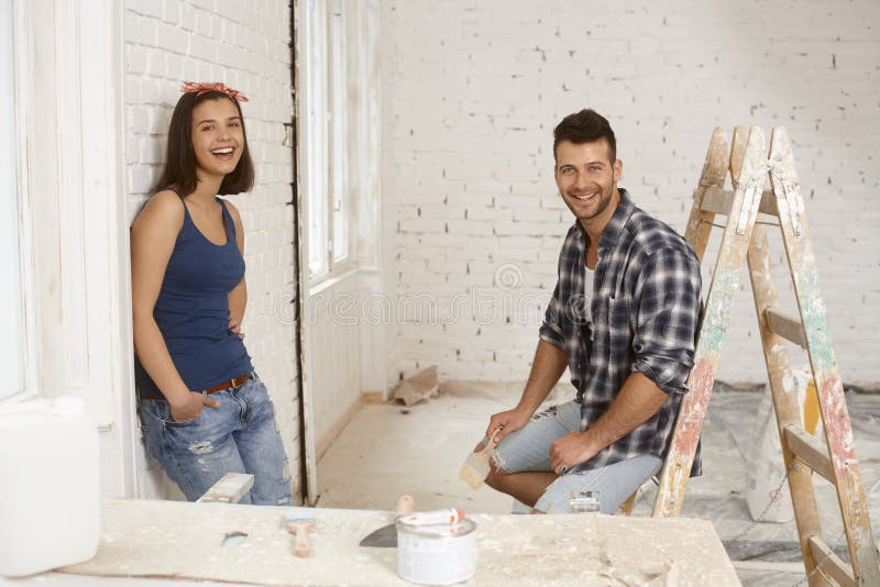 Happy couple at renovation site royalty free stock photos