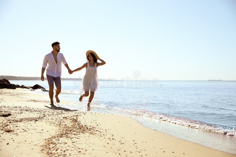 Happy Couple Running On Beach Near Sea Honeymoon Trip Stock Image Image Of Girlfriend Love