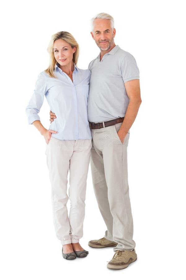 Happy couple standing and smiling at camera on white background. Cut smiling stock images, royalty-free photos and pictures