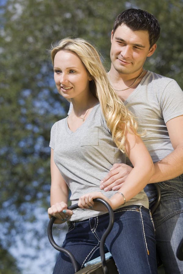 Happy couple on swing