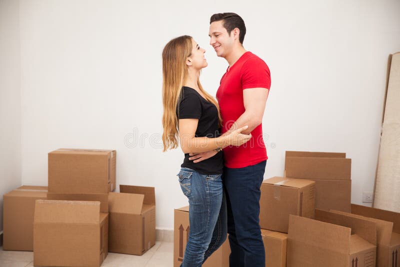 Happy Couple In Their New Home Stock Photo Image Of Brunette