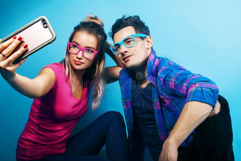 happy couple together posing cheerful blue background wearing glasses guy girl students together friends closeup happy 151568095
