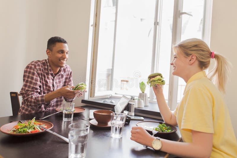 Happy couple in vegan restaurant