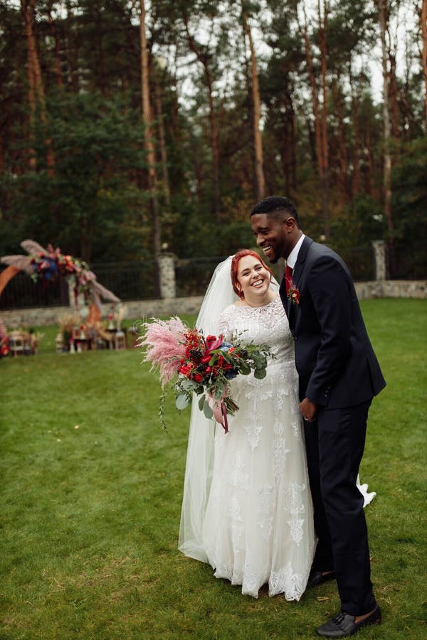 https://thumbs.dreamstime.com/b/happy-couple-wedding-day-smiling-handsome-african-american-man-lovely-white-woman-enjoy-moment-charming-groom-cuddle-213811376.jpg