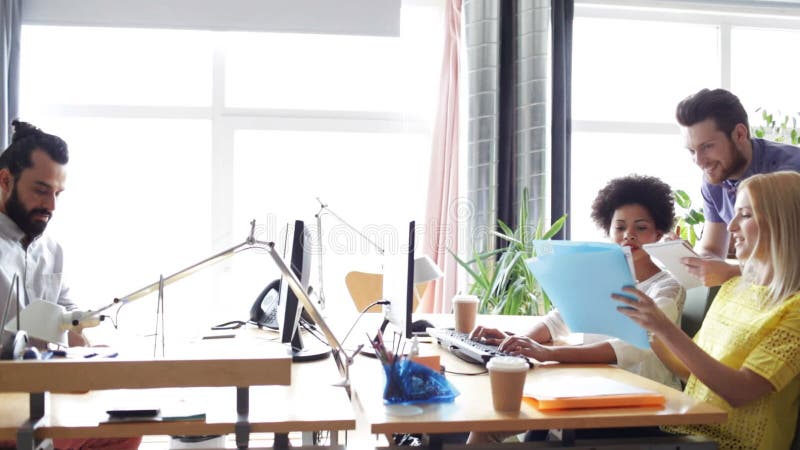 Happy creative team with computers in office stock video footage