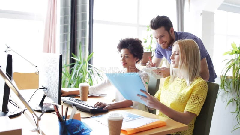 Happy creative team with computers in office stock video footage