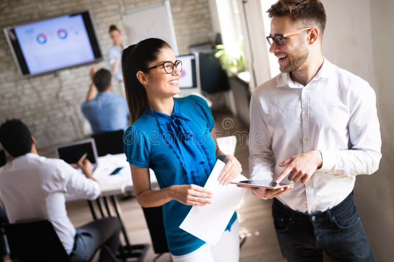 Happy creative team in office. Business, startup, design, people and teamwork concept stock photography Happy creative team in office. Business, startup, design, people and teamwork concept stock photography