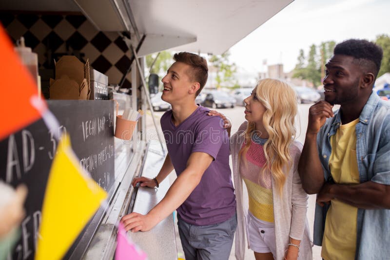 Happy customers queue or friends at food truck stock photos Happy customers queue or friends at food truck stock photos