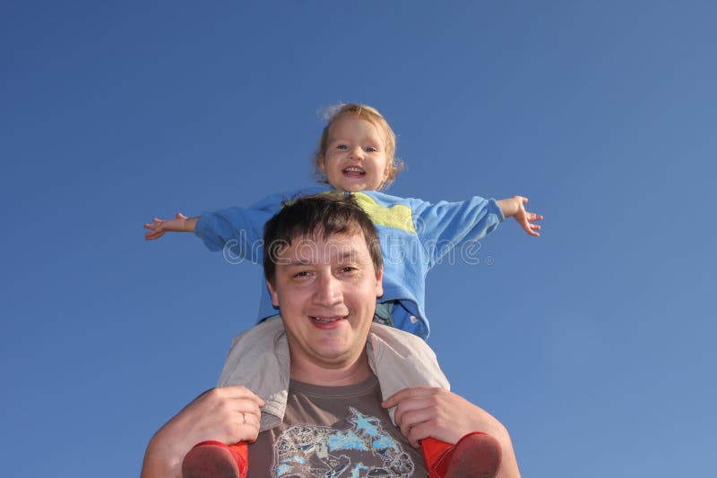 Happy the daddy with a daughter against the sky royalty free stock image