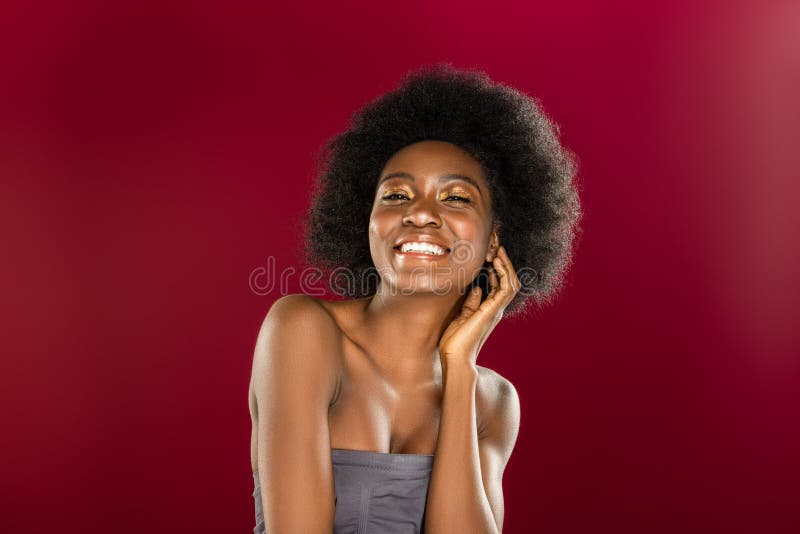 Delighted positive young woman touching her ear royalty free stock photography Delighted positive young woman touching her ear royalty free stock photography