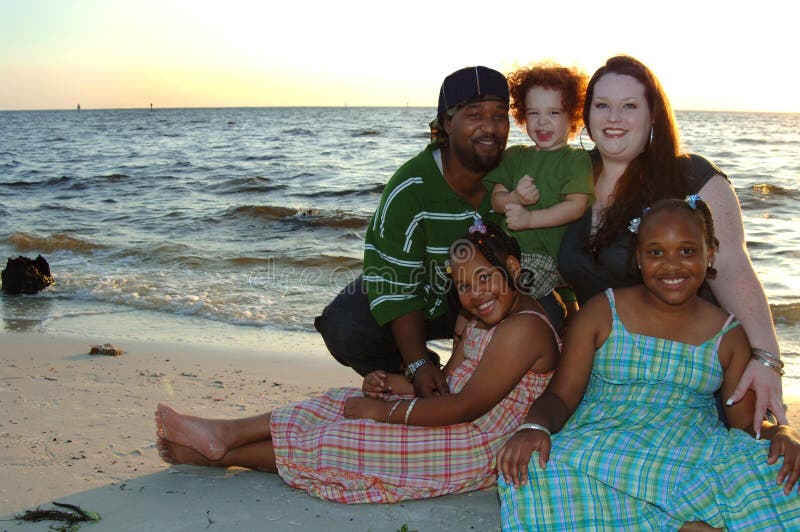 Happy diverse family at beach