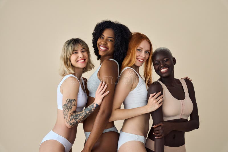 4 Happy Diverse Young Girls in Underwear Hugging Isolated on Beige  Background. Stock Photo - Image of looking, models: 293417884