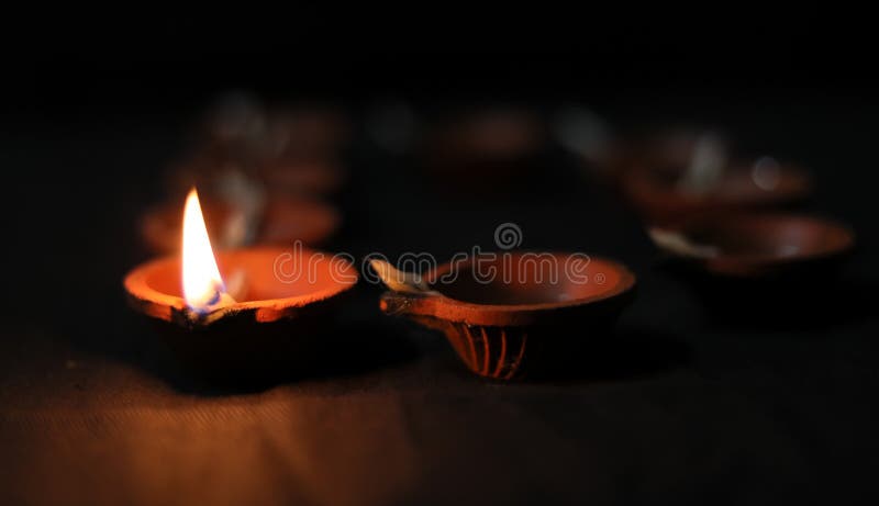 Happy Diwali - Lit Diya Lamps in the Dark Black Background Stock Photo -  Image of happiness, clay: 162032858