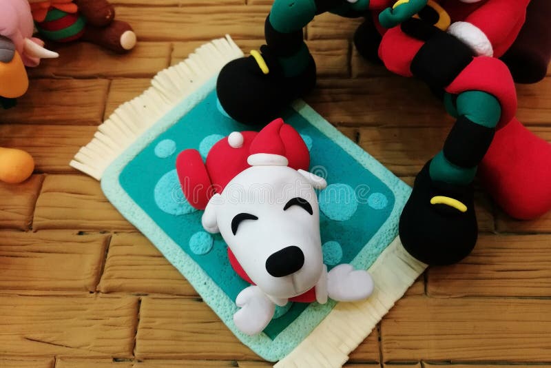 Happy dog made from polymer clay, Christmas costume theme