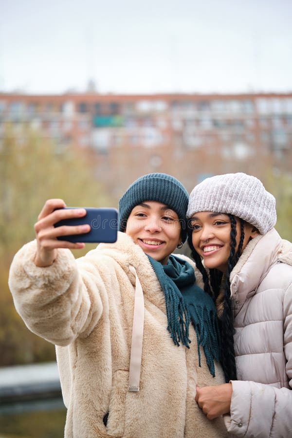 Dominican Lesbian Couple Hugging With Affection And Love At Street In Winter Stock Image 