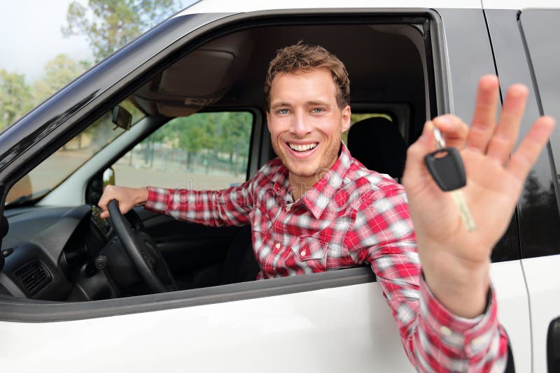 Happy driving man showing new car keys or rental royalty free stock photos Happy driving man showing new car keys or rental royalty free stock photos