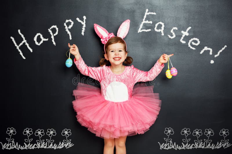 Happy easter! Child with bunny ears and eggs. stock image