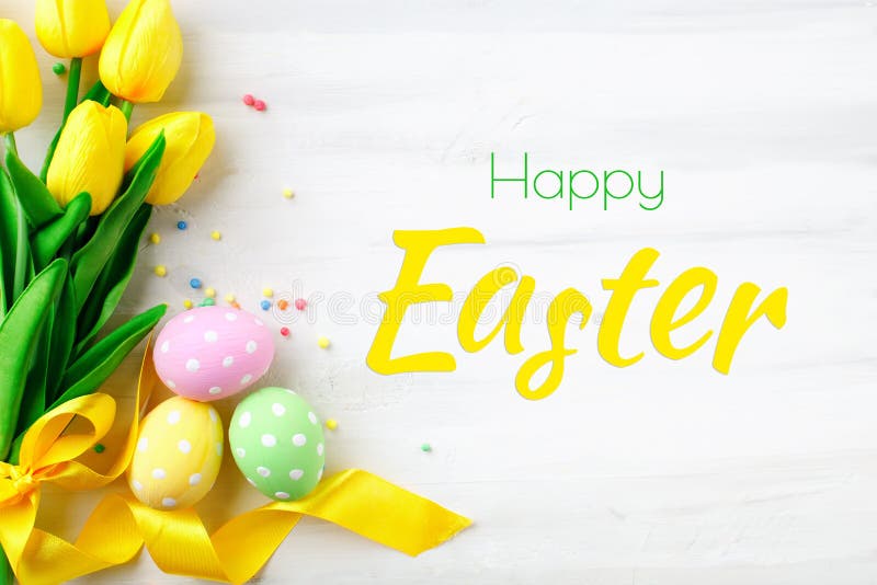 Happy Easter. Congratulatory easter background. Easter eggs and flowers. royalty free stock image