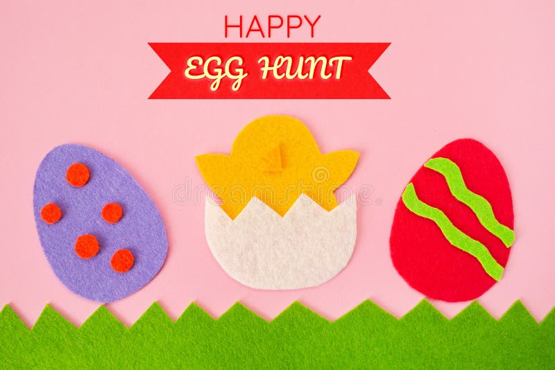 Happy Easter. Cut out the felt applications of colorful eggs and the chicken hatched from the egg. Pink background. Flat lay stock photos
