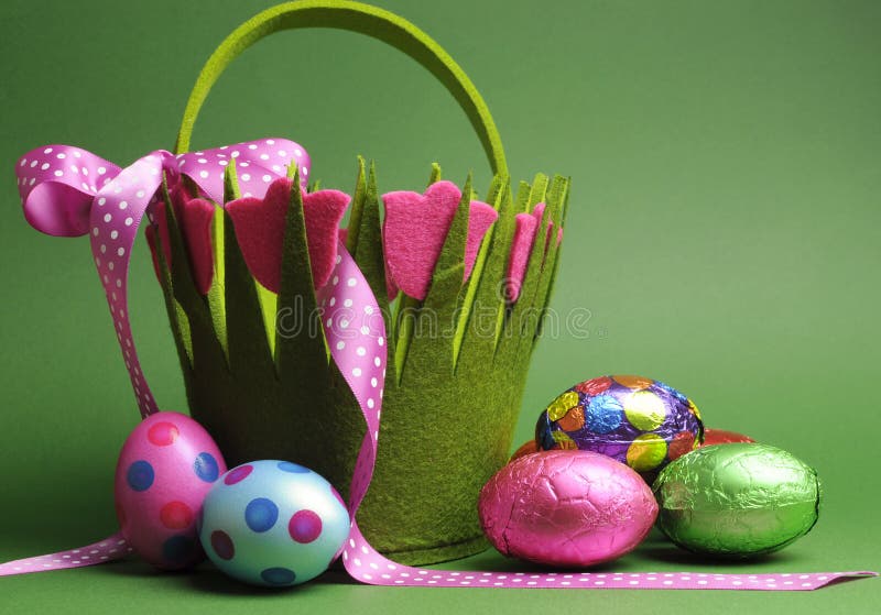 Easter egg hunt with colorful Spring theme polka dot carry basket bag and chocolate Easter eggs